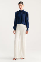 Off white high waisted clean wide leg tailored, full styled look, by SOLA Pakistan.