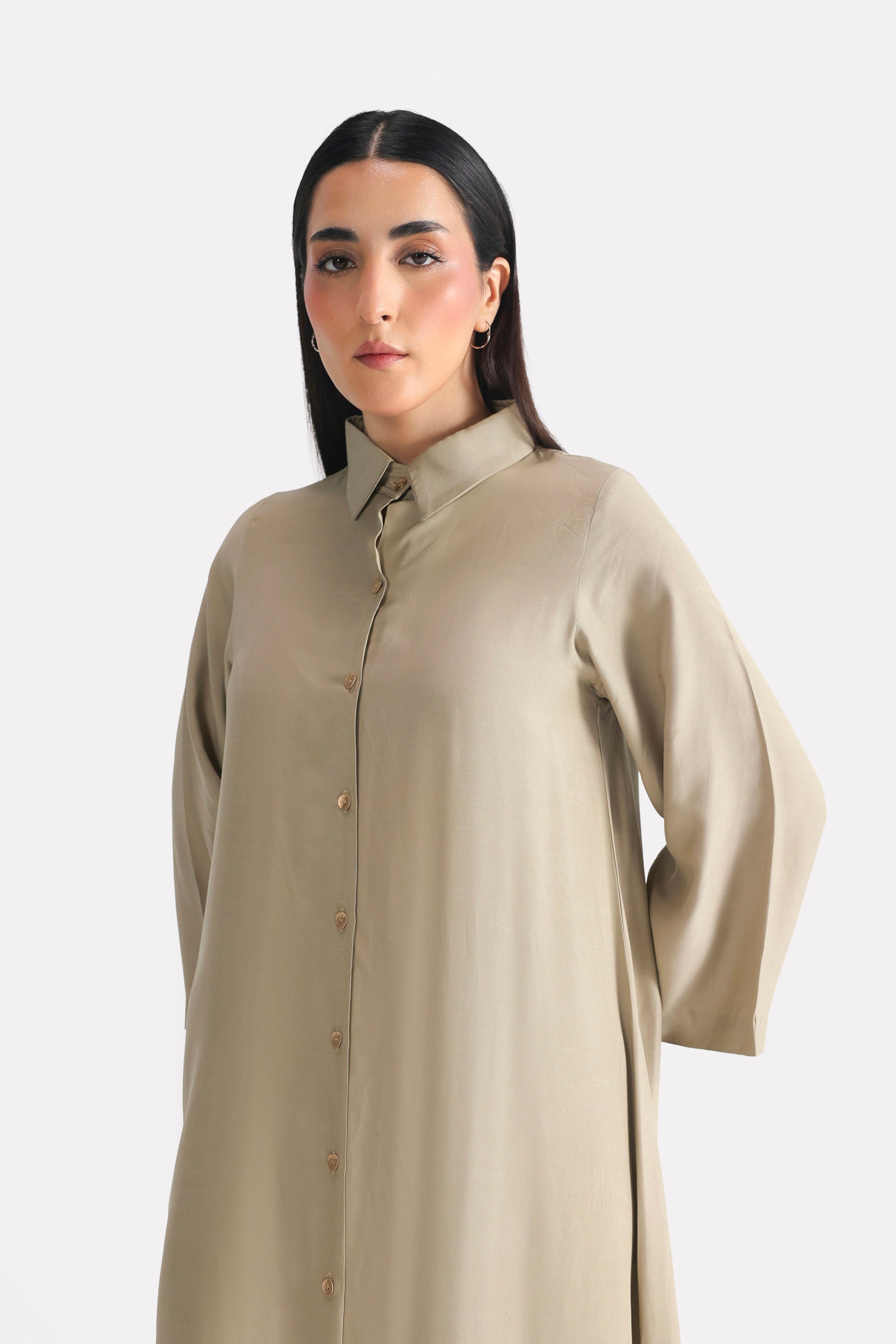 Close-up detail on the olive button detail co-ord top, by SOLA Pakistan.