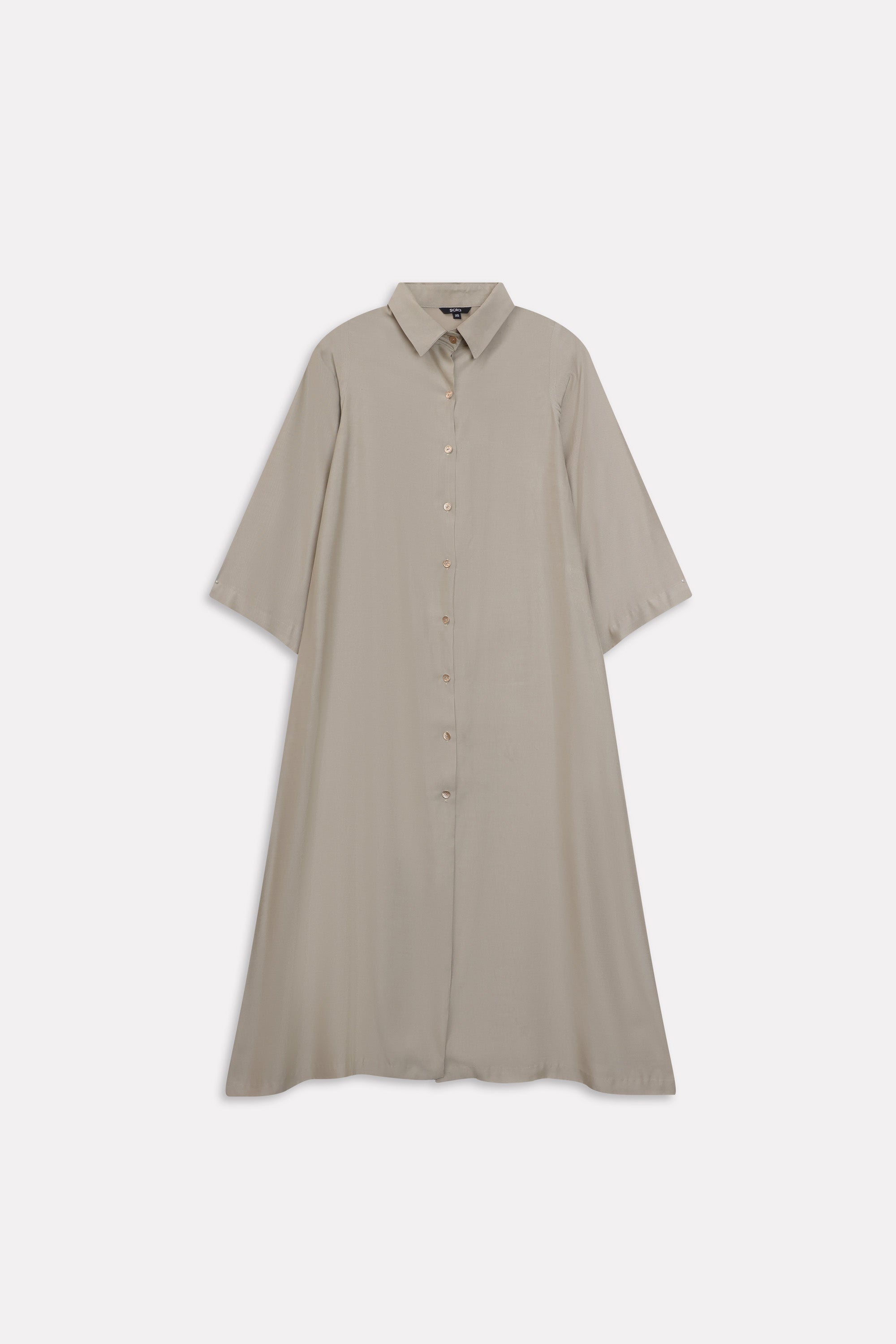 Flat lay of the olive button detail co-ord top, by SOLA Pakistan.