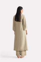 Olive button detail co-ord top shown in a styled fit, by SOLA Pakistan.