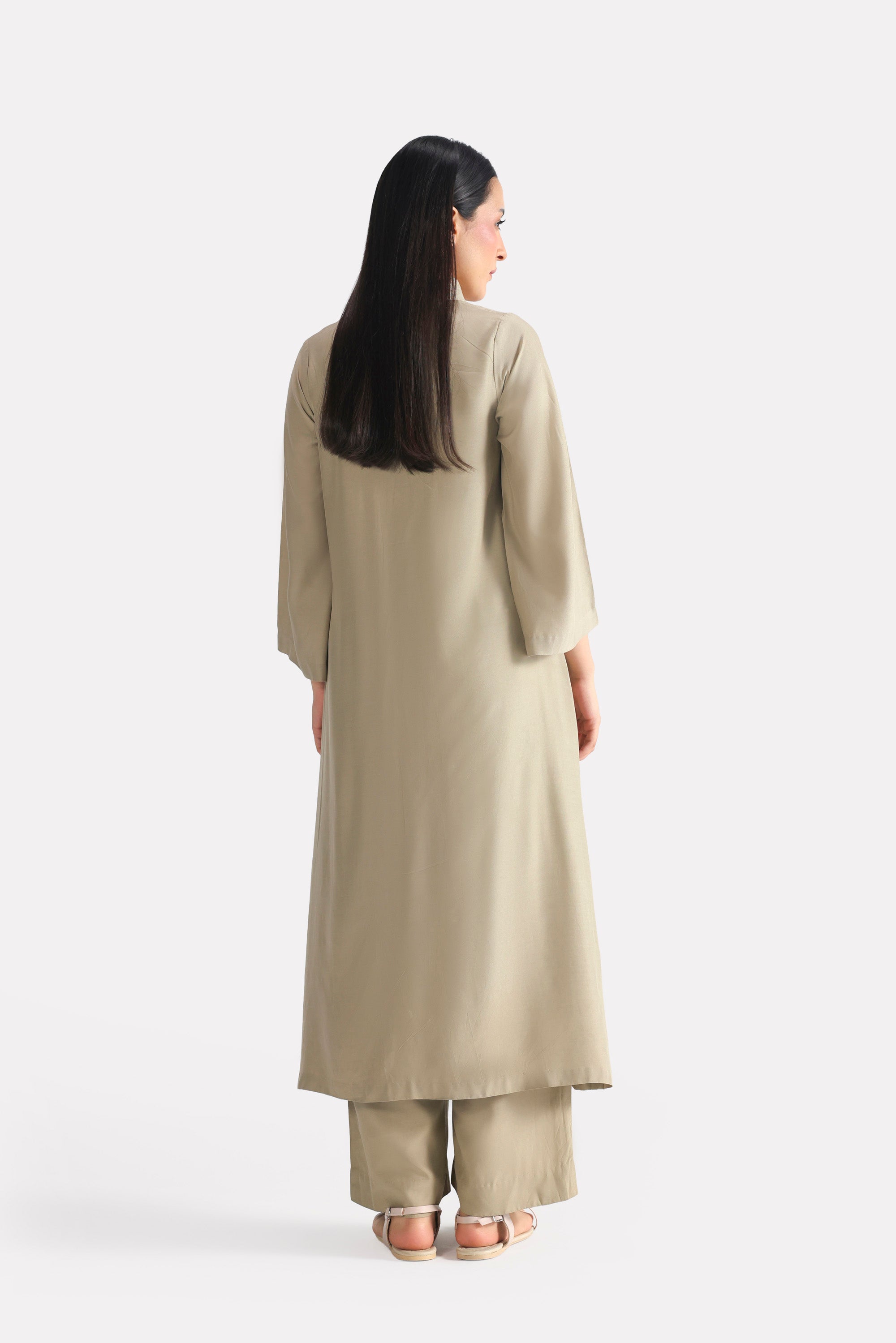 Olive button detail co-ord top shown in a styled fit, by SOLA Pakistan.