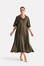 Olive green (deep olive) relaxed midi dress in silk, worn by a model, by SOLA Pakistan.