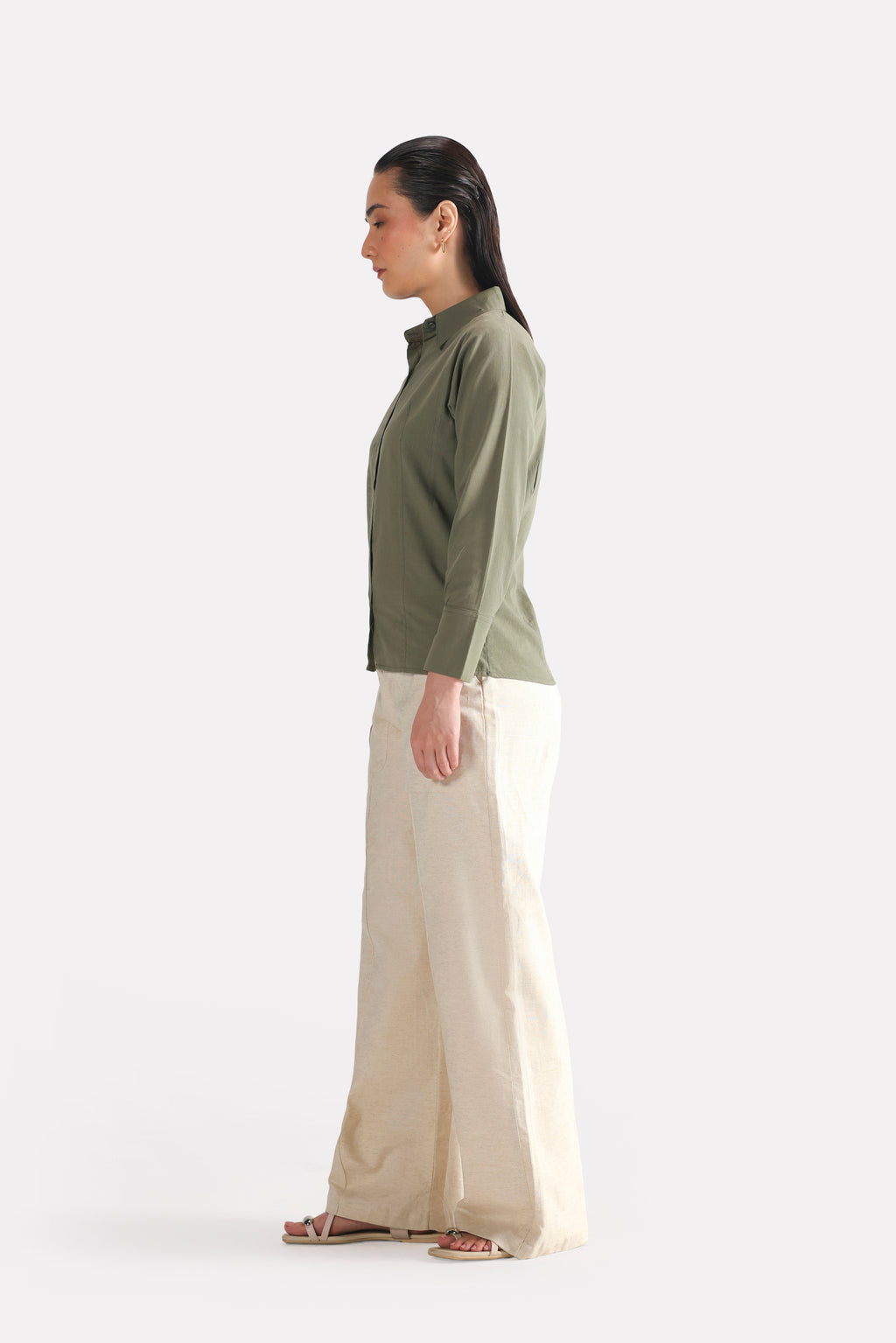 Flat lay of the olive refined pleated woven shirt, by SOLA Pakistan.