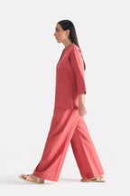 Peach (apricot) loop & lounge bottom, full styled look, by SOLA Pakistan.