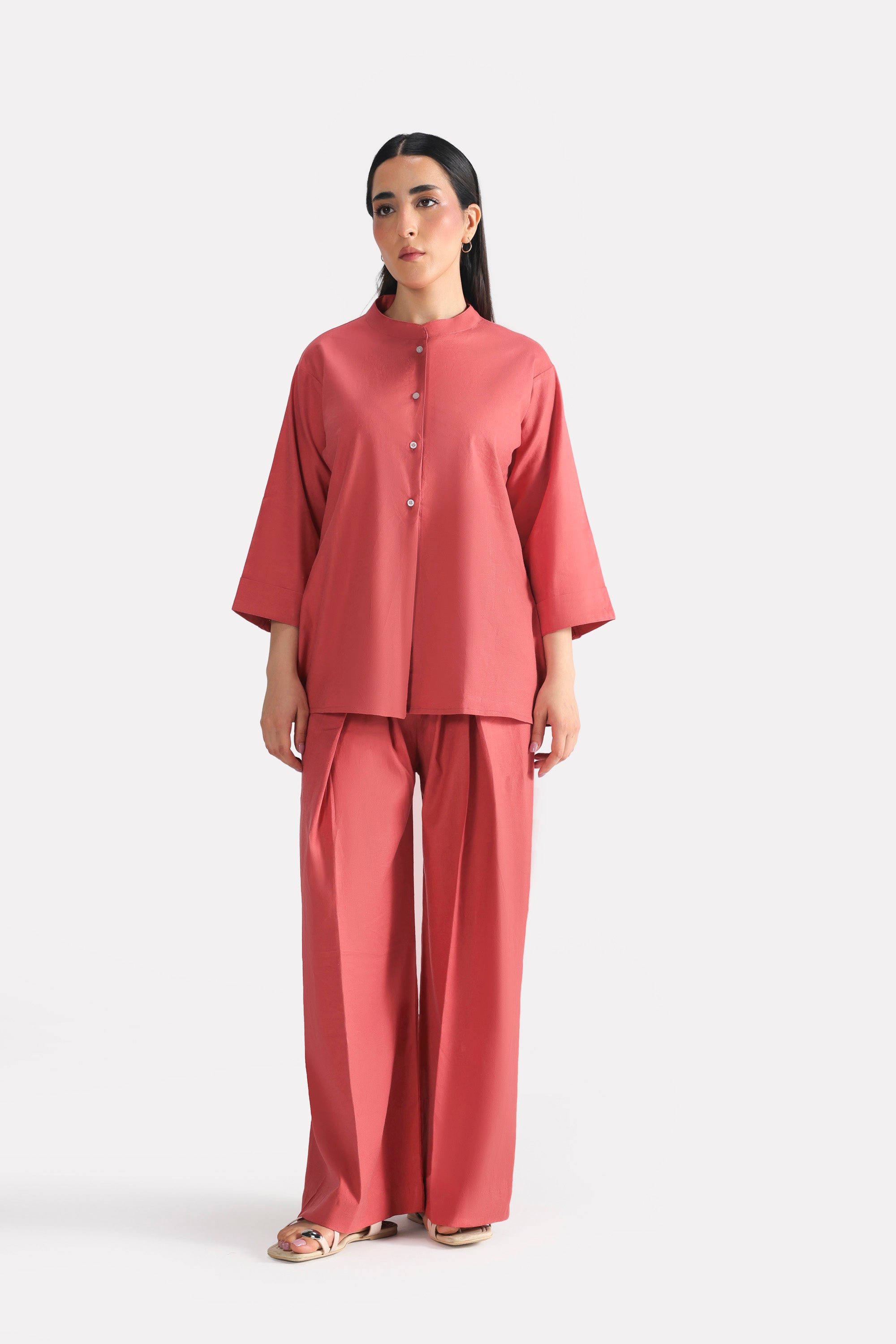 Peach (apricot) loop & lounge bottom in cotton-linen blend, worn by a model, by SOLA Pakistan.