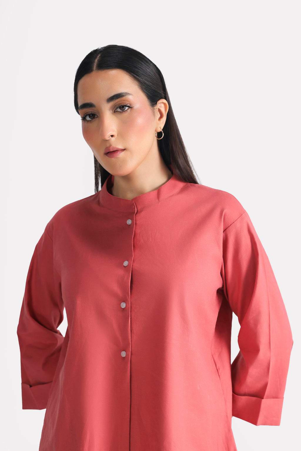 Flat lay of the peach (apricot) loop & lounge top, by SOLA Pakistan.