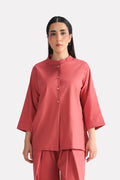 Peach (apricot) loop & lounge top in cotton-linen blend, worn by a model, by SOLA Pakistan.