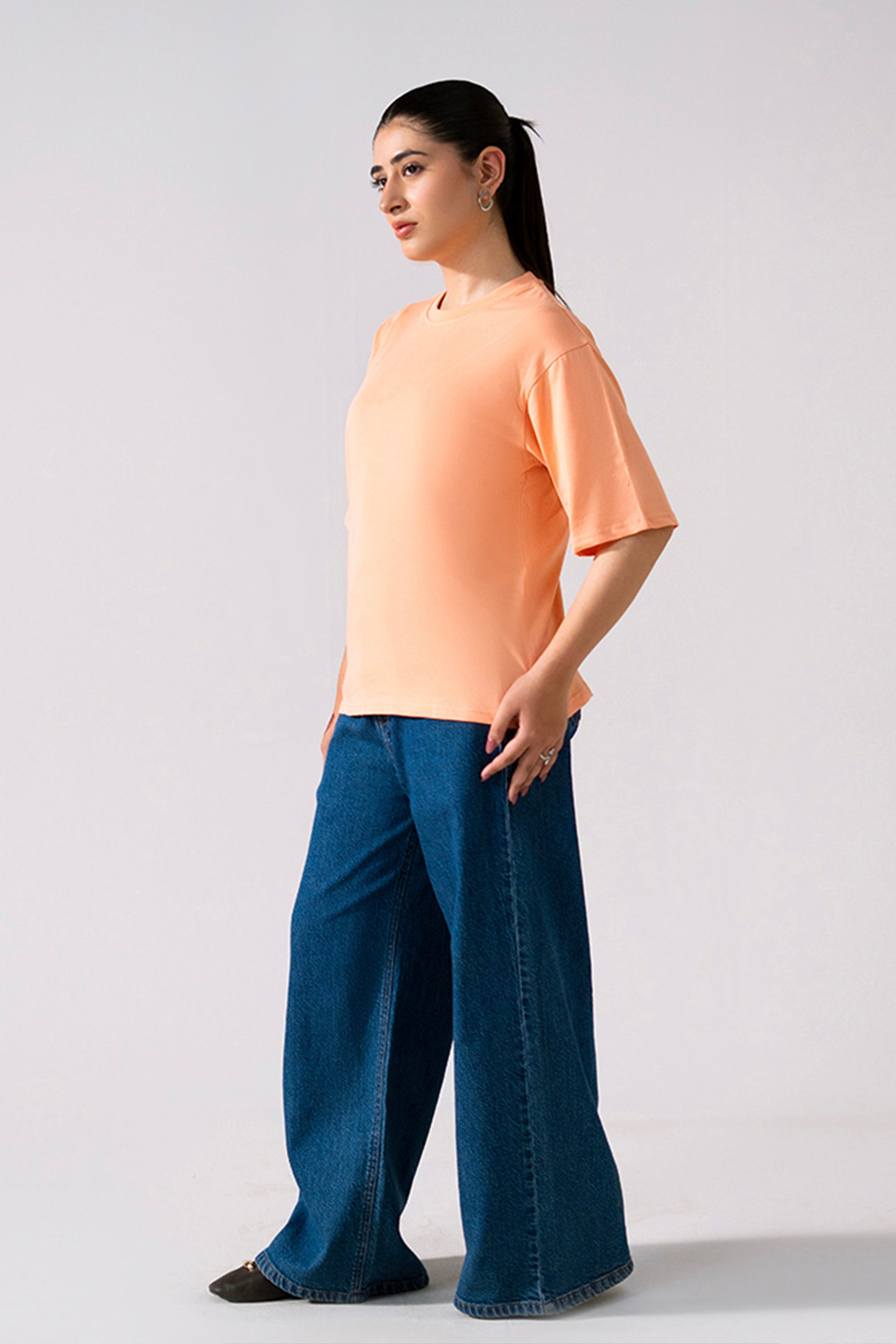 Peach (apricot) round neck t-shirt, full styled look, by SOLA Pakistan.