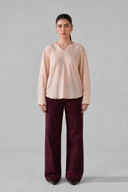 Pink powder pink top shown in a styled fit, by SOLA Pakistan.