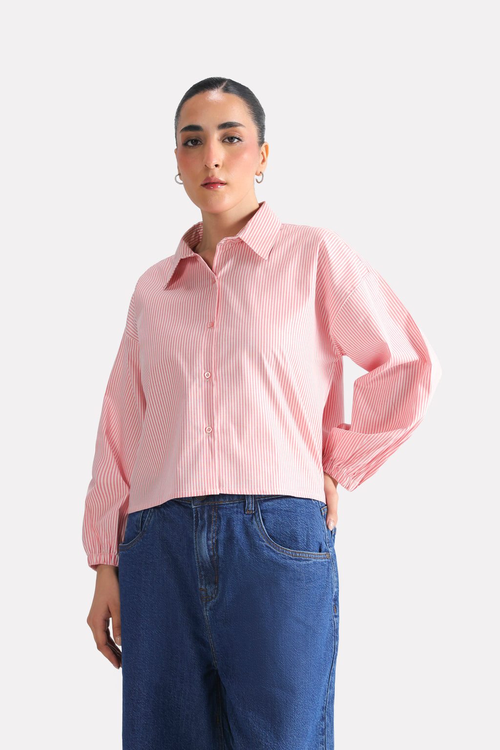 Flat lay of the pink & white stripe striped chic shacket, by SOLA Pakistan.