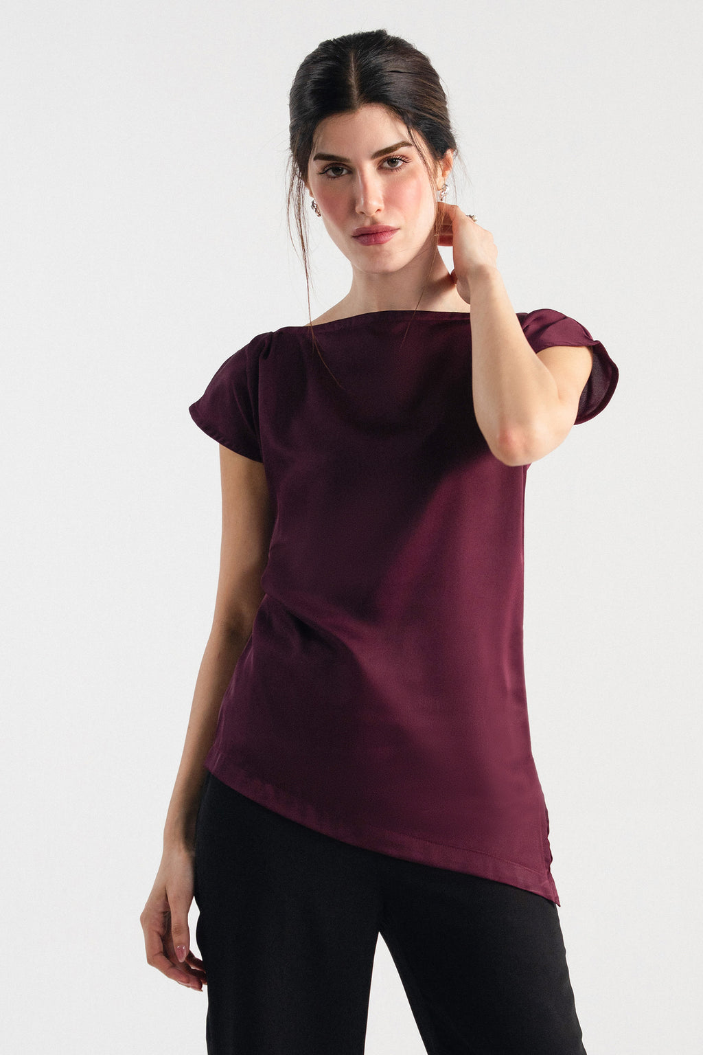 Close-up detail on the plum drapped asymmetrical wrap top, by SOLA Pakistan.