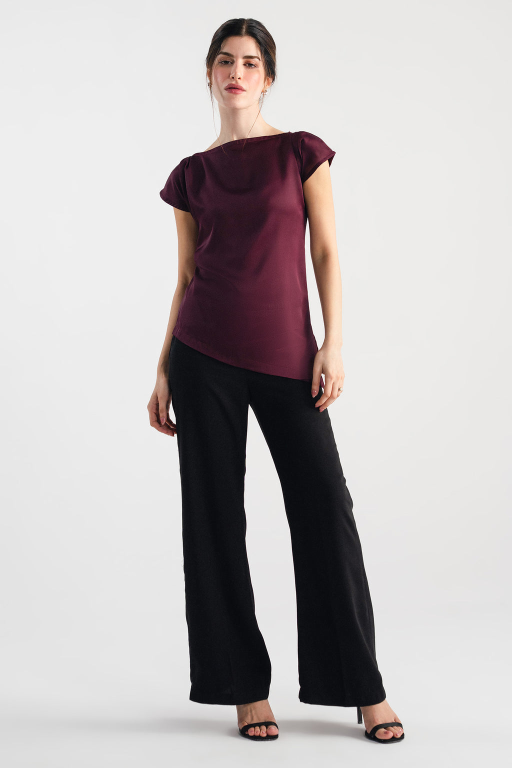 Plum drapped asymmetrical wrap top, worn by a model, by SOLA Pakistan.