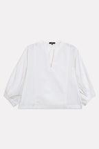 Close-up detail on the white balloon sleeve relaxed top, by SOLA Pakistan.