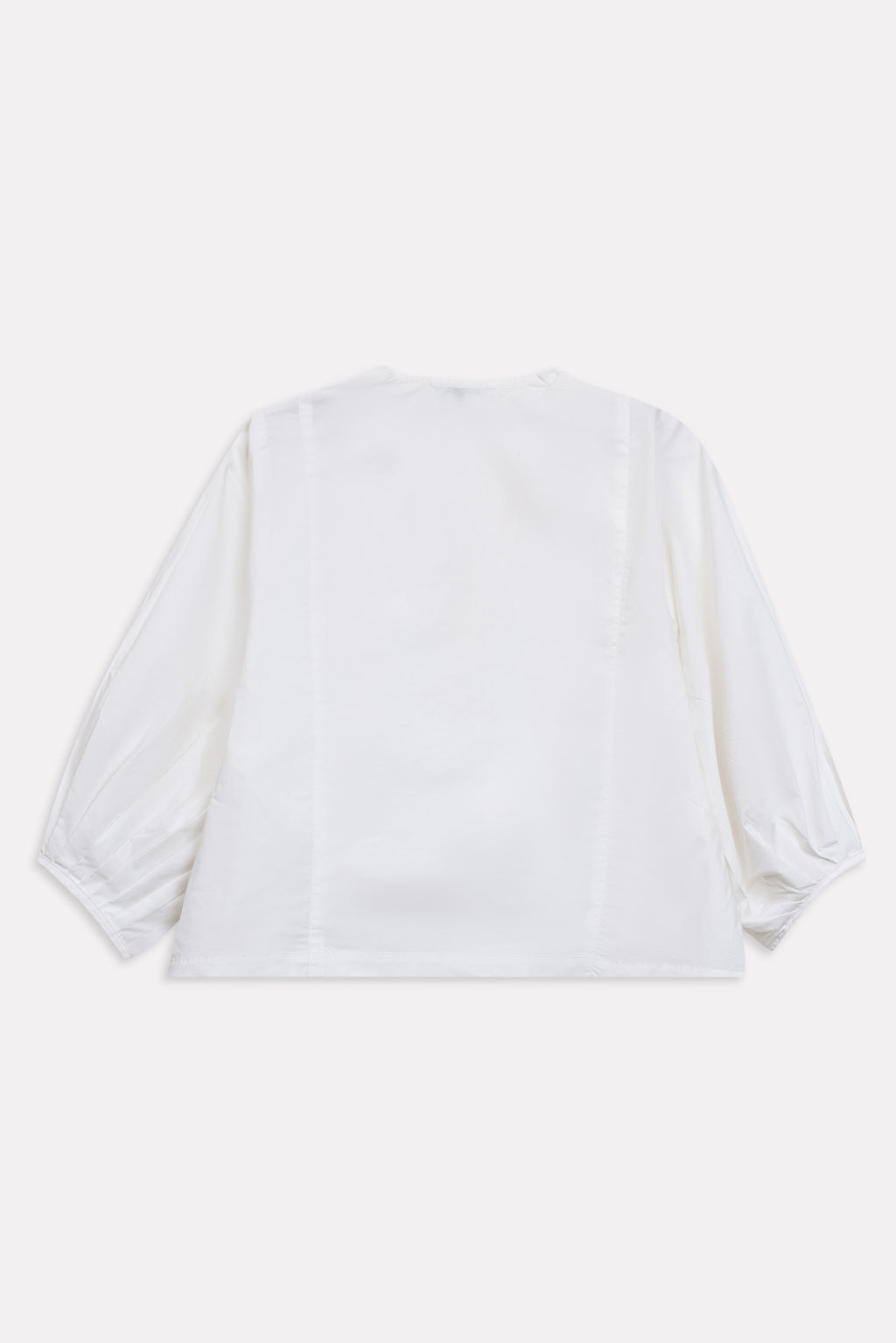 White balloon sleeve relaxed top shown in a styled fit, by SOLA Pakistan.