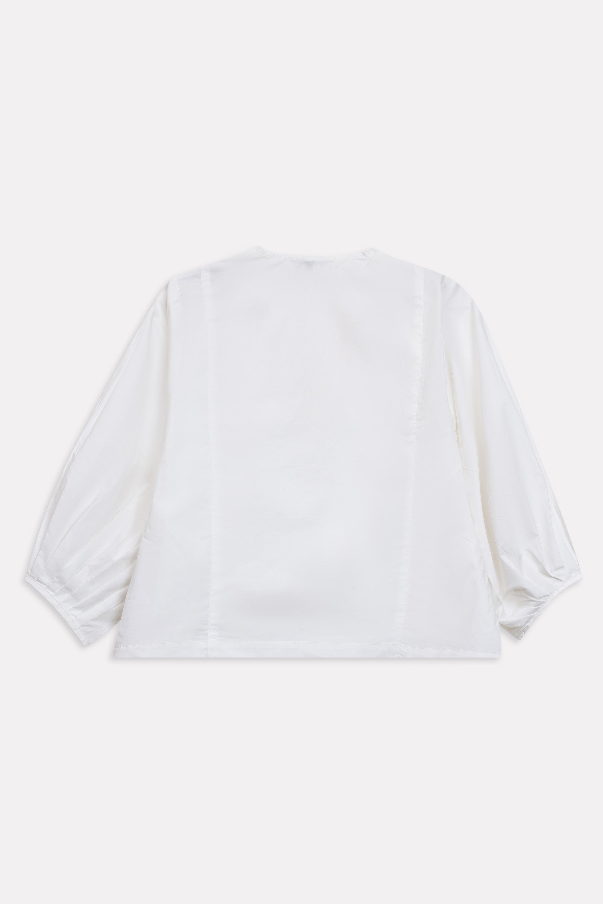 White balloon sleeve relaxed top shown in a styled fit, by SOLA Pakistan.