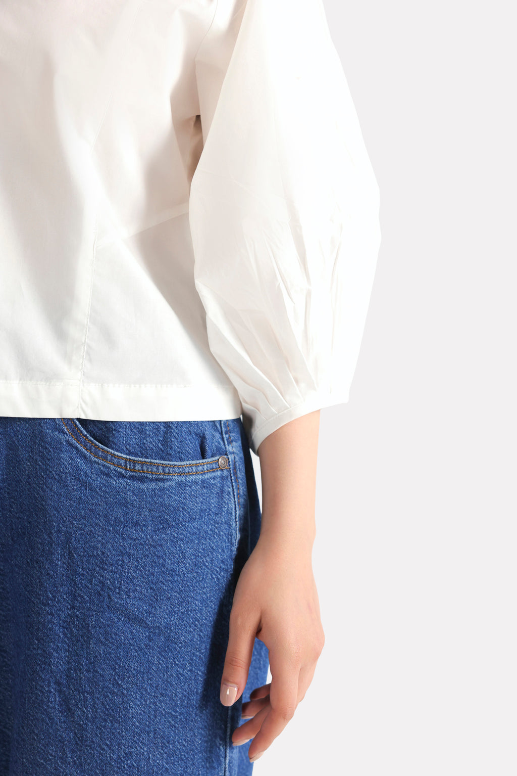 Texture and fabric detail, white balloon sleeve relaxed top, by SOLA Pakistan.