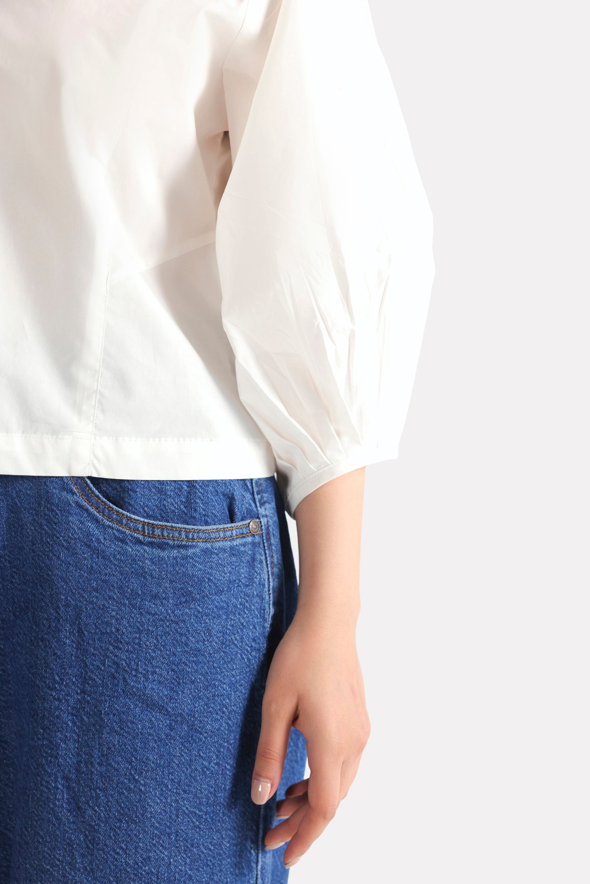 Texture and fabric detail, white balloon sleeve relaxed top, by SOLA Pakistan.