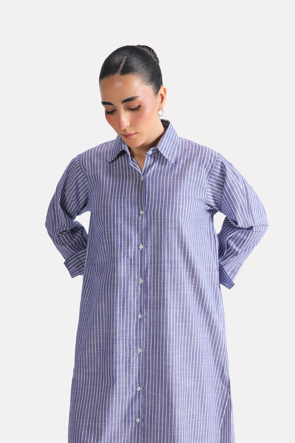 Close-up detail on the white & blue fit & flare shirt dress, by SOLA Pakistan.