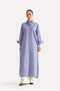 White & blue fit & flare shirt dress in cotton, worn by a model, by SOLA Pakistan.