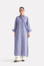 White & blue fit & flare shirt dress in cotton, worn by a model, by SOLA Pakistan.
