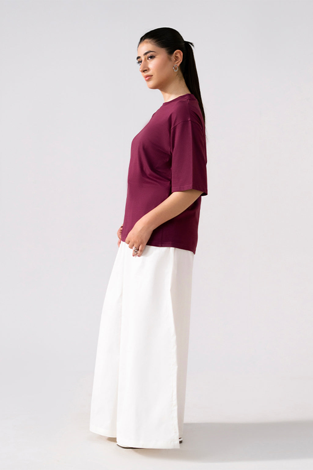 Flat lay of the white cotton wide trousers, by SOLA Pakistan.