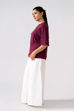 Flat lay of the white cotton wide trousers, by SOLA Pakistan.