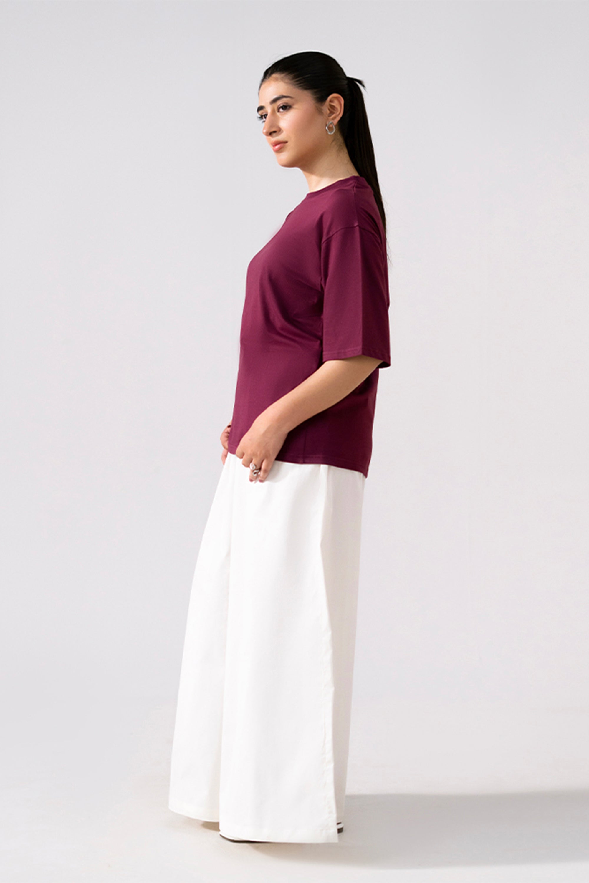 Flat lay of the white cotton wide trousers, by SOLA Pakistan.