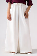 White cotton wide trousers, full styled look, by SOLA Pakistan.