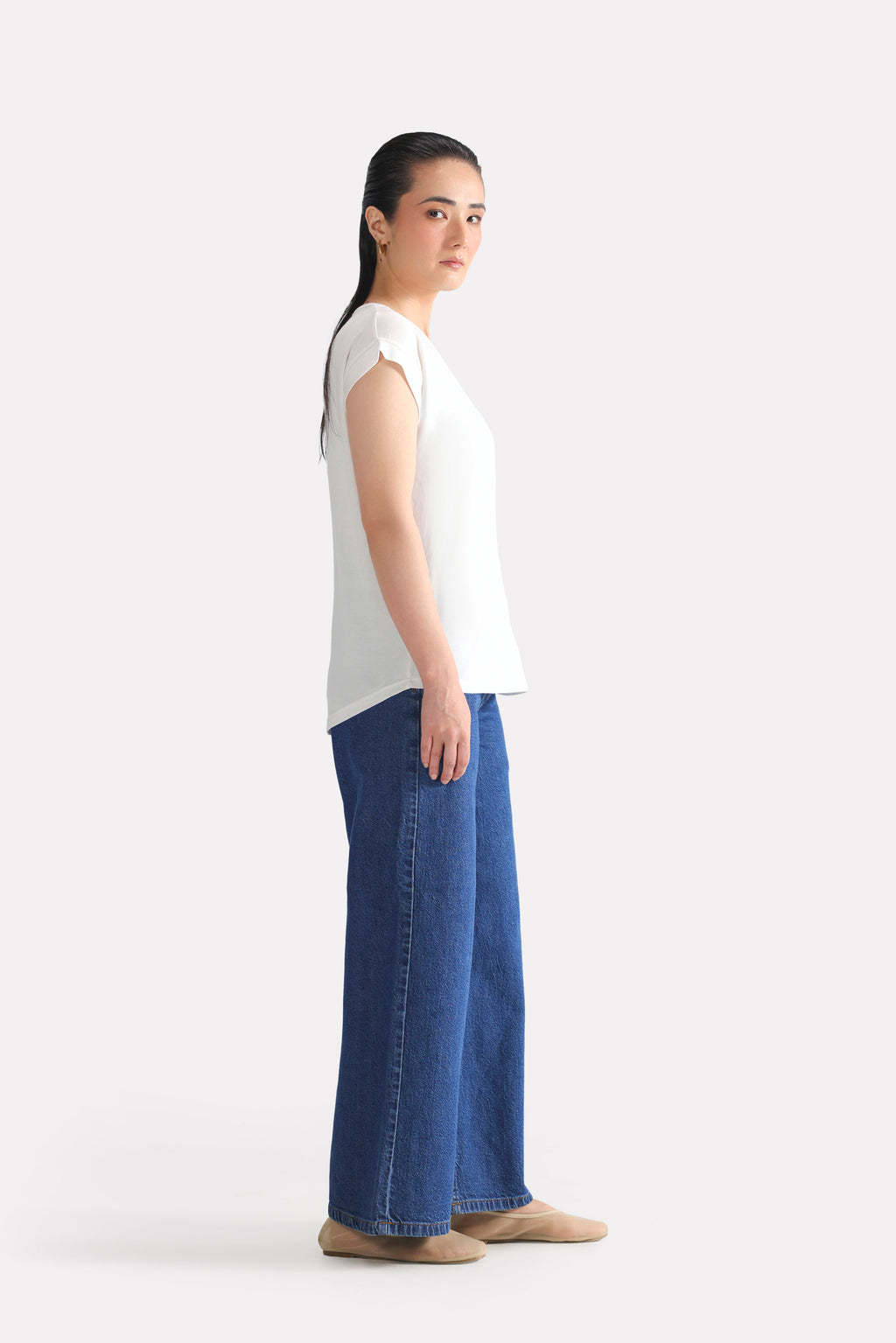 Close-up detail on the white featherweight modal t-shirt, by SOLA Pakistan.