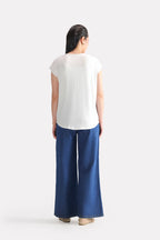 Flat lay of the white featherweight modal t-shirt, by SOLA Pakistan.