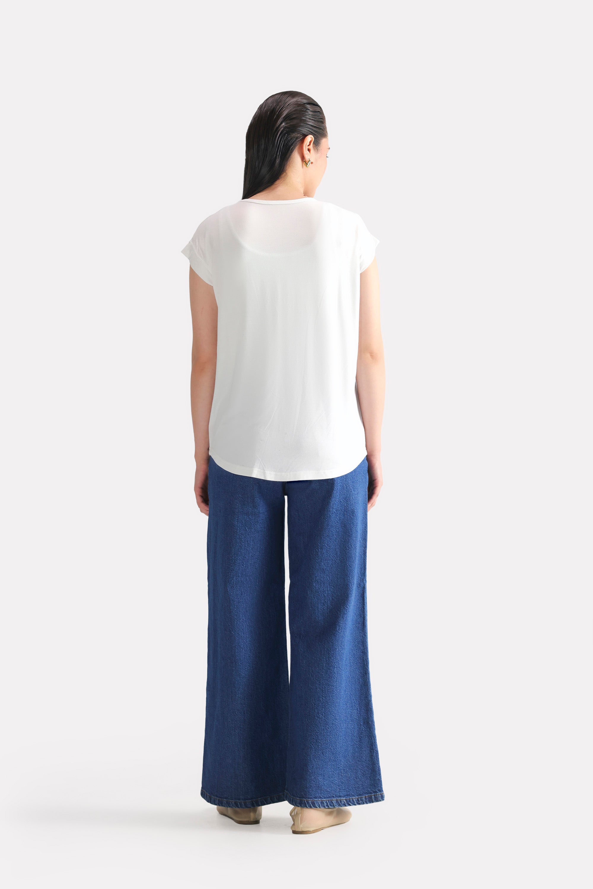 Flat lay of the white featherweight modal t-shirt, by SOLA Pakistan.
