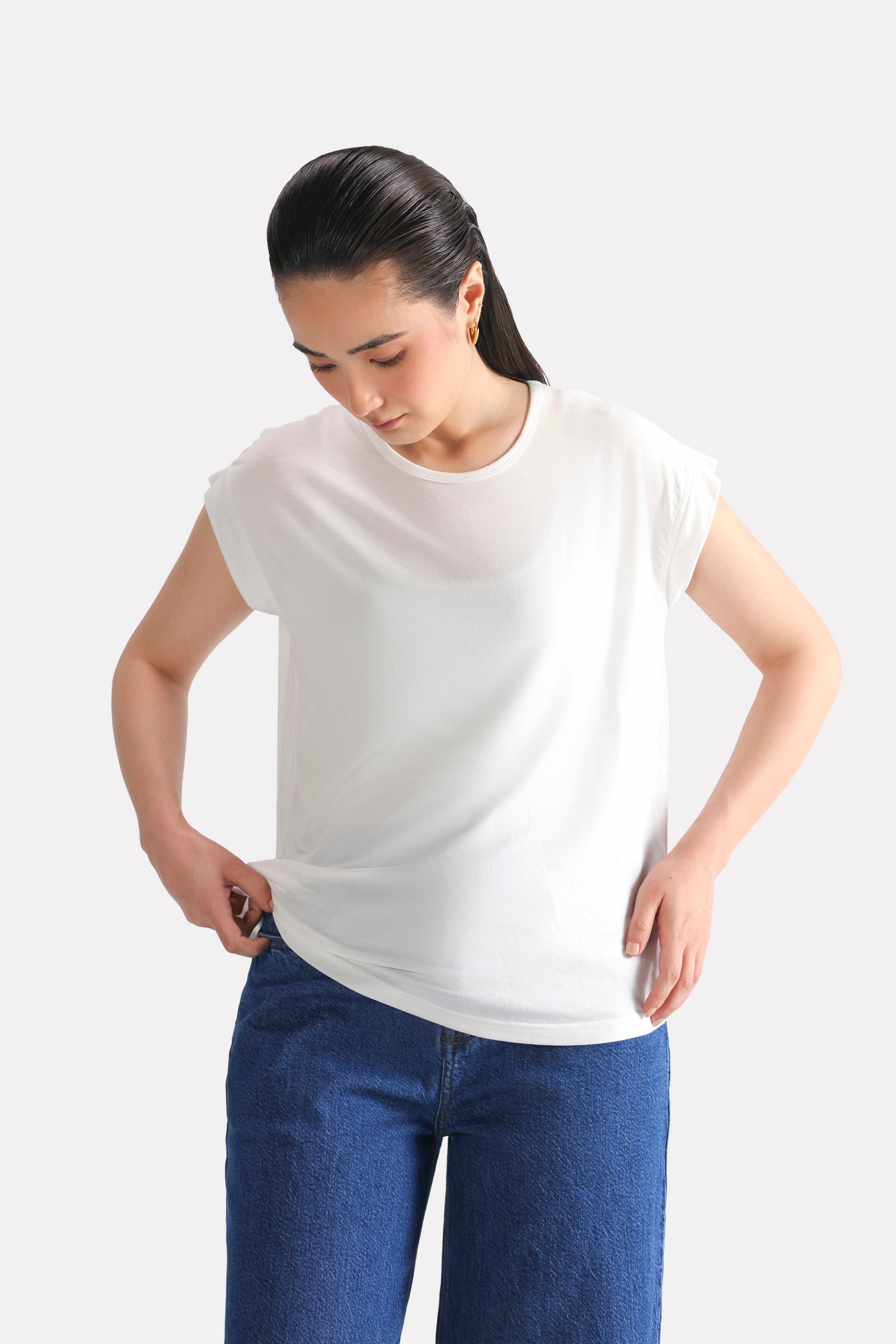 White featherweight modal t-shirt shown in a styled fit, by SOLA Pakistan.