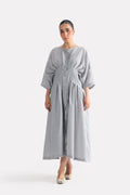 White & grey cinched waist seersucker dress in viscose-cotton blend, worn by a model, by SOLA Pakistan.