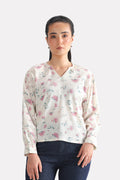 White & pink floral print blossom top in polyester crepe, worn by a model, by SOLA Pakistan.