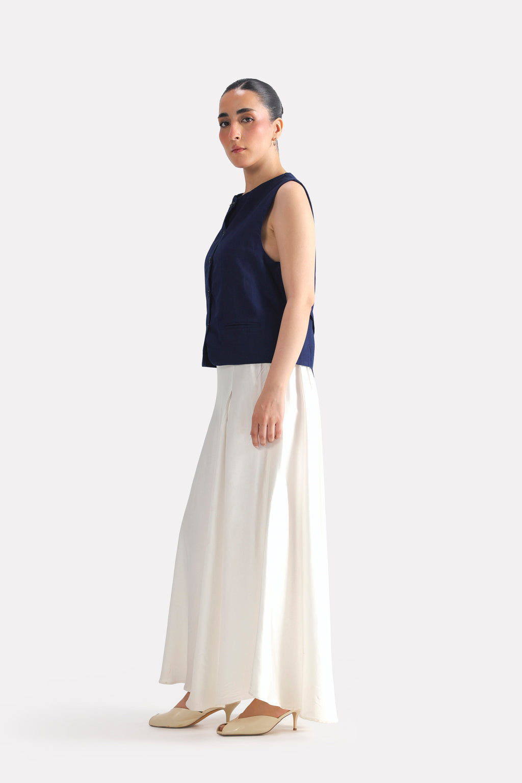 Close-up detail on the white satin silk skirt, by SOLA Pakistan.
