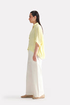 Yellow bubble hem oversized top, alternate angle, by SOLA Pakistan.