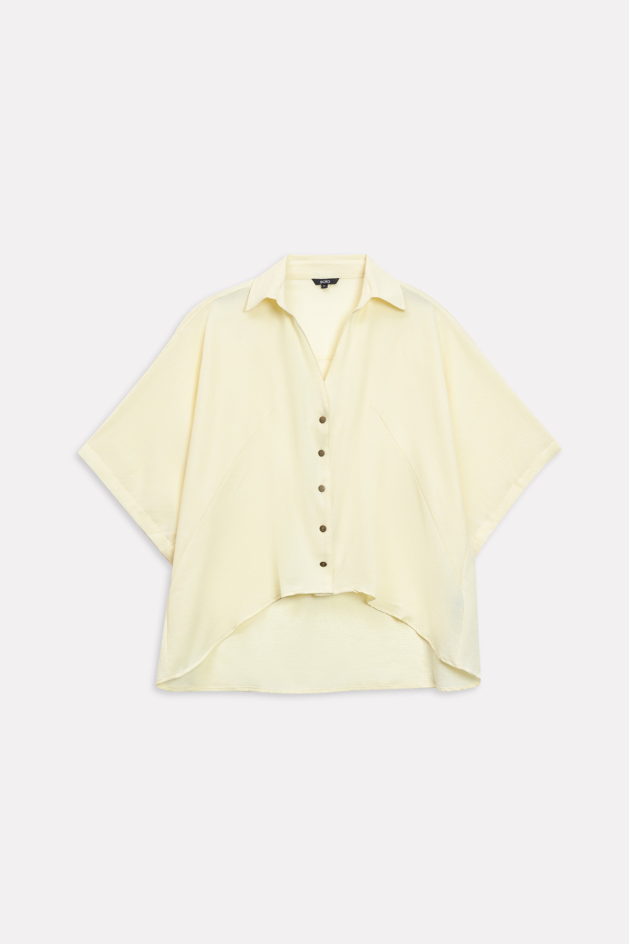 Yellow bubble hem oversized top shown in a styled fit, by SOLA Pakistan.